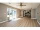 Bright living room featuring modern fan, sliding glass doors, and backyard views at 102 Challis Ct, Goose Creek, SC 29445