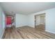 Bright living room featuring wood floors and a red front door at 102 Challis Ct, Goose Creek, SC 29445