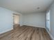Neutral living room featuring luxury vinyl plank flooring and freshly painted walls at 102 Challis Ct, Goose Creek, SC 29445