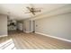Bright living room featuring modern fan and open layout into the kitchen at 102 Challis Ct, Goose Creek, SC 29445