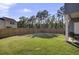 Expansive, well-maintained backyard with lush green grass and a tall wooden fence for privacy, great for outdoor activities at 1032 Berry Patch Cir, Summerville, SC 29485