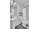 Compact bathroom featuring pedestal sink, toilet, and shower-tub combo with sleek hardware at 1032 Berry Patch Cir, Summerville, SC 29485