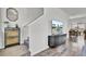 Inviting entryway featuring wood-look flooring, modern decor, and staircase access to the upper level at 1032 Berry Patch Cir, Summerville, SC 29485