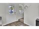 Inviting entryway with a white door, a sidelight window, light walls, and hardwood flooring at 1032 Berry Patch Cir, Summerville, SC 29485