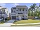 Charming two-story home with light blue siding, a gray garage door, and a well-manicured green lawn at 1032 Berry Patch Cir, Summerville, SC 29485