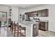 Open kitchen with a breakfast bar, pendant lighting, granite countertops, and stainless steel appliances at 1032 Berry Patch Cir, Summerville, SC 29485