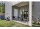Cozy patio with a small table and chairs, ideal for outdoor relaxation and entertaining, in a fenced backyard at 1032 Berry Patch Cir, Summerville, SC 29485