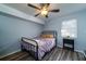 Cozy bedroom featuring hardwood floors, a ceiling fan, and natural light from a window at 1054 Anna Knapp Blvd # 4E, Mount Pleasant, SC 29464