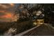 Stunning view of the lake gazebo at sunset through the spanish moss canopy at 1054 Anna Knapp Blvd # 4E, Mount Pleasant, SC 29464