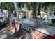 Outdoor grilling area featuring stainless steel grills and a brick surround by the pool at 1054 Anna Knapp Blvd # 4E, Mount Pleasant, SC 29464