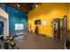 Community gym with modern weight training equipment, free weights, and vibrant decor at 1054 Anna Knapp Blvd # 4E, Mount Pleasant, SC 29464