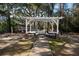 Outdoor picnic area with tables, barbecue, and benches under a covered pergola at 1054 Anna Knapp Blvd # 4E, Mount Pleasant, SC 29464