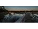 Scenic pier at twilight showcasing the serene waterway views and marshlands at 1054 Anna Knapp Blvd # 4E, Mount Pleasant, SC 29464
