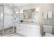 Bright bathroom featuring a glass shower, marble countertops, and ample cabinet space at 1109 Diodia Ct, Kiawah Island, SC 29455