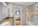 Bathroom view into the bedroom with tiled shower and natural light at 1109 Diodia Ct, Kiawah Island, SC 29455