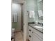 Bright bathroom featuring granite counters, vanity, mirror, and walk-in shower at 1109 Diodia Ct, Kiawah Island, SC 29455