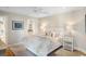 Comfortable bedroom with coastal décor, ceiling fan, and ensuite bathroom at 1109 Diodia Ct, Kiawah Island, SC 29455