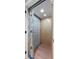 Residential elevator with wood paneling and sliding gate for easy access between floors at 1109 Diodia Ct, Kiawah Island, SC 29455