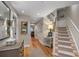 Inviting hallway with hardwood floors, staircase, and neutral paint at 1109 Diodia Ct, Kiawah Island, SC 29455