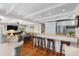 Open floor plan with a kitchen island, bar seating, stainless steel appliances, and easy access to the living area at 1109 Diodia Ct, Kiawah Island, SC 29455