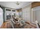 Cozy living room with a view of the ocean, built-in cabinets, and natural light at 1109 Diodia Ct, Kiawah Island, SC 29455