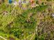 Elevated view of a home nestled in lush trees with a scenic backdrop of greenery and ponds at 1117 Walleye Rd, Bonneau, SC 29431