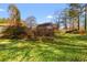 Expansive backyard featuring lush greenery and potential for landscaping or recreational activities at 1117 Walleye Rd, Bonneau, SC 29431