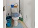 Small bathroom with toilet and blue seat cover and rug at 1117 Walleye Rd, Bonneau, SC 29431