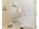 Clean, well-lit bathroom featuring a shower with curtain, white door, and minimal decor at 1117 Walleye Rd, Bonneau, SC 29431