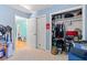Bedroom with blue walls and closet featuring extensive storage at 1117 Walleye Rd, Bonneau, SC 29431