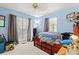 Bedroom with light blue walls, windows, and a ceiling fan at 1117 Walleye Rd, Bonneau, SC 29431