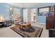 Comfortable sitting area with a recliner, round table and soft natural lighting at 1117 Walleye Rd, Bonneau, SC 29431