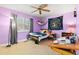 A bedroom with purple walls, a ceiling fan, and a window at 1117 Walleye Rd, Bonneau, SC 29431