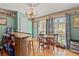 Cozy dining area featuring built in bar and natural light at 1117 Walleye Rd, Bonneau, SC 29431