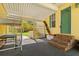 Covered area outside with brick steps leading into home and view of courtyard at 1117 Walleye Rd, Bonneau, SC 29431
