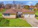 Charming one-story home featuring a manicured lawn and an attached two-car garage at 1117 Walleye Rd, Bonneau, SC 29431