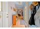 Light-filled hallway featuring a coat rack, shoe storage, and hardwood floors at 1117 Walleye Rd, Bonneau, SC 29431