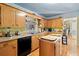 Well-lit kitchen with wooden cabinets, an island and modern appliances at 1117 Walleye Rd, Bonneau, SC 29431