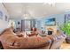 Bright and open living area with a fireplace, vaulted ceiling, and wood floors at 1117 Walleye Rd, Bonneau, SC 29431
