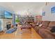 Comfortable living room with a fireplace, wood floors, and ample seating at 1117 Walleye Rd, Bonneau, SC 29431