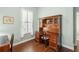 Home office with a wooden desk, built-in storage, and a bright window at 112 Etiwan Park St, Charleston, SC 29492