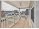 Balcony view showcasing the neighborhood with white railings and ceiling fan at 120 Diploma Dr, Ladson, SC 29456