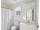 Well-lit bathroom with a clean white vanity and shower with curtain at 120 Diploma Dr, Ladson, SC 29456