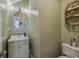 Charming half bathroom features a stylish vanity, mirror, and fixtures at 120 Diploma Dr, Ladson, SC 29456
