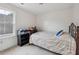 Bedroom with a black shoe rack, large window, and a queen bed at 120 Diploma Dr, Ladson, SC 29456