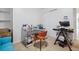 Home office with clear glass desk, blue futon, and closet with shelves at 120 Diploma Dr, Ladson, SC 29456
