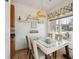 Bright dining area with modern lighting fixture, window, and comfortable seating at 120 Diploma Dr, Ladson, SC 29456