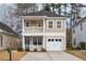 Charming two-story home with a double balcony and a well-manicured lawn at 120 Diploma Dr, Ladson, SC 29456