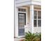 Inviting front entry with a glass-paneled door and manicured plants at 120 Diploma Dr, Ladson, SC 29456