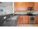 Well-equipped kitchen with stainless appliances and tiled backsplash at 120 Diploma Dr, Ladson, SC 29456